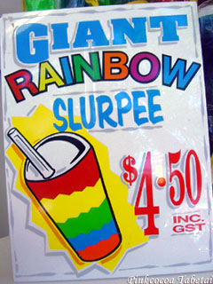 Giant Rainbow Slurpee Sign