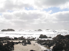 [Photo of ocean waves on rocks]