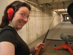 Elly looking very happy as she reloads a small calibre rifle